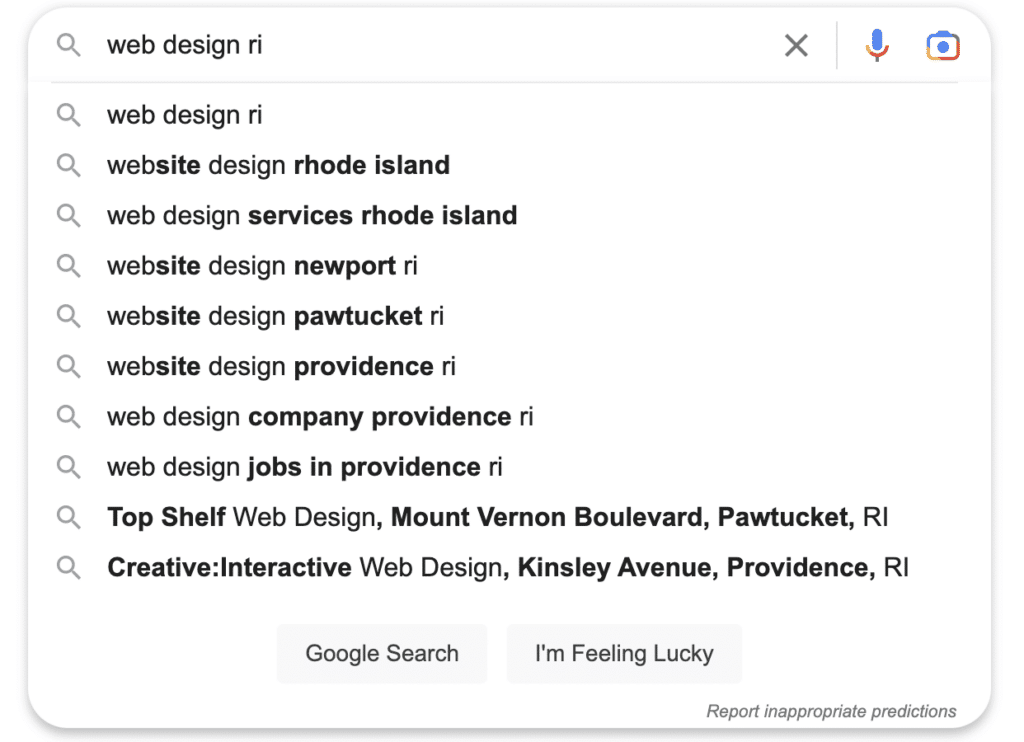 Screenshot of typing "web design RI" into the google search page with google's smart suggestions.